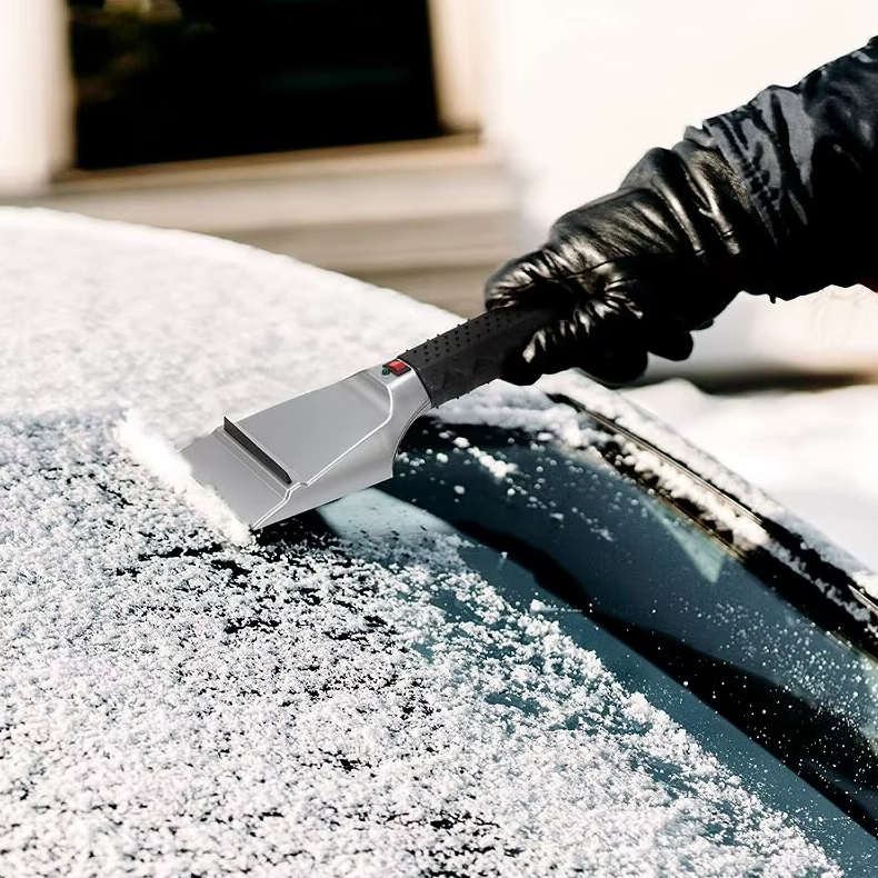 Heated snow shovel